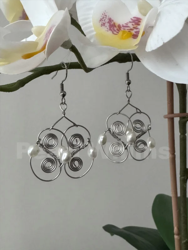 Macro View of Coil Echo Earrings – Hidden Inner Spiral Figure-Eight Motif in Surgical-Grade Steel